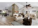 Spacious living room with stone fireplace and comfortable seating at 1925 Jamaica Way, Punta Gorda, FL 33950