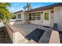 Inviting front porch with brick pavers and entryway at 725 Patty Ave, Punta Gorda, FL 33950