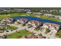 Community overview showcasing homes near golf course and lake at 14025 Black Beauty Dr # 412, Punta Gorda, FL 33955
