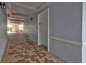 Hallway with elevator access and tile flooring at 2001 Bal Harbor Blvd # 2312, Punta Gorda, FL 33950