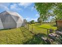 Home's side view, showcasing the backyard at 15871 Huffmaster Rd, North Fort Myers, FL 33917