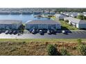 Aerial view of condo community near lake with pool at 3310 Loveland Blvd # 2304, Punta Gorda, FL 33980