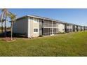 Back view of condo building showcasing screened patios at 3310 Loveland Blvd # 2304, Punta Gorda, FL 33980