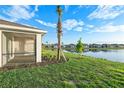 Screened porch overlooking a lake and homes at 16891 Caracara Pl, Punta Gorda, FL 33982