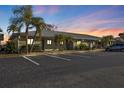 Condo building exterior at dusk with parking at 25225 Rampart Blvd # 502, Punta Gorda, FL 33983