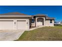 House exterior showcasing two-car garage and front entrance at 740 Kingfish Ct, Punta Gorda, FL 33950