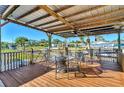Relaxing covered patio with table and chairs, overlooking the canal at 824 E 6Th St, Englewood, FL 34223