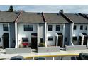 Front view of townhouses with gray roofs and white walls at 2000 Forrest Nelson Blvd # C8, Port Charlotte, FL 33952