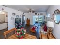 Living room with view of lake from sliding doors at 2160 Heron Lake Dr # 104, Port Charlotte, FL 33983