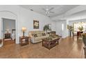 Bright living room with tile floors and neutral colored furniture at 24400 Westgate Blvd, Punta Gorda, FL 33980