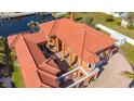 Bird's eye view of a large home with a courtyard and tile roof at 108 Roselle Ct, Port Charlotte, FL 33952