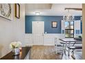 Farmhouse style dining room with chandelier and built-in bench seating at 2084 La Palma Ave, Port Charlotte, FL 33953