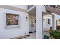 Inviting apartment building exterior featuring well-maintained landscaping and a charming entrance at 26485 Rampart Blvd # E7, Punta Gorda, FL 33983