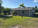 Single story home with a large grassy yard at 4525 Church St, Punta Gorda, FL 33980