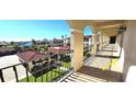 Water view from condo balcony with wrought iron railing and columns at 1 Colony Point Dr # 16C, Punta Gorda, FL 33950