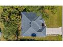 Top-down view of a single-story house showcasing its roofline and driveway at 267 Lecturn St, Port Charlotte, FL 33954