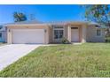 Newly built single story house with a two-car garage at 267 Lecturn St, Port Charlotte, FL 33954
