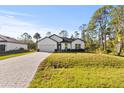 Property showcasing a house with a spacious lawn at 14059 Gailwood Ave, Port Charlotte, FL 33953