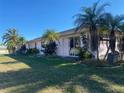 Back view of the house showcasing the large backyard at 2091 Onondaga Ln, Punta Gorda, FL 33983