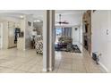 Open living area with fireplace, kitchen, and access to backyard at 3310 Middletown St, Port Charlotte, FL 33952