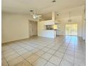 Spacious living room with tile floors and high ceilings at 6222 Berkeley St, Englewood, FL 34224