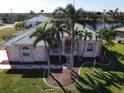 Bird's eye view of charming house with mature landscaping at 649 Maltese Dr, Punta Gorda, FL 33950