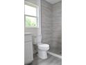 Clean bathroom with a shower, toilet, and white vanity at 11278 4Th Ave, Punta Gorda, FL 33955