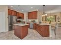 Spacious kitchen featuring stainless steel appliances, granite countertops and an island, perfect for cooking and entertaining at 1205 Bartlett Ave, North Port, FL 34288