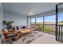 Cozy outdoor balcony features stylish seating, ceiling fan, and beautiful neighborhood views at 14224 Heritage Landing Blvd # 926, Punta Gorda, FL 33955