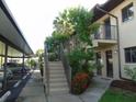 Condo building exterior showcasing stairs and landscaping at 4048 Oakview Dr # F2-3, Punta Gorda, FL 33980