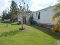 Landscaped yard with shed and well-maintained lawn at 6546 Greenview Ct, North Port, FL 34287
