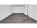 Bright bedroom with gray vinyl plank flooring and neutral walls, featuring ample space at 3004 Banyan Way, Punta Gorda, FL 33950