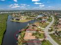 Waterfront home with private boat dock, lush landscaping, and stunning views of the surrounding canals and neighborhood at 3310 Tripoli Blvd, Punta Gorda, FL 33950