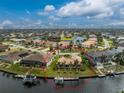 Waterfront home with private dock and lush green lawn at 3310 Tripoli Blvd, Punta Gorda, FL 33950