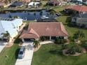 Charming home with a tile roof, attached garage, and well-maintained landscaping in a lovely neighborhood at 3448 Nighthawk Ct, Punta Gorda, FL 33950