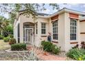 Front entrance with a metal gate and a paved pathway at 10494 Princess Ct, Punta Gorda, FL 33955