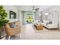 Open living area with a sectional sofa and access to a patio at 2051 Royal Tern Cir, Punta Gorda, FL 33983