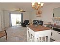 Living room with sliding doors to balcony at 3310 Loveland Blvd # 1408, Port Charlotte, FL 33980