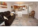 Living room features leather reclining sofa and rug at 3310 Loveland Blvd # 1408, Port Charlotte, FL 33980
