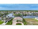 Stunning aerial view of waterfront home in a luxury community at 4025 Maltese Ct, Punta Gorda, FL 33950