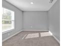 Spacious bedroom with neutral wall paint and carpeted floors at 4210 Jody Ave, North Port, FL 34288