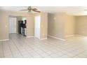 Living room, kitchen, and dining area with tile floors at 21471 Dranson Ave, Port Charlotte, FL 33952