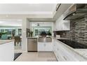 Modern kitchen with stainless steel appliances and granite countertops at 241 Sorrento Ct, Punta Gorda, FL 33950