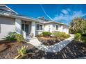 House exterior showcasing walkway, landscaping, and architectural details at 3307 Nevis Ct, Punta Gorda, FL 33950