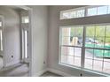 Bright foyer with large windows offering natural light, neutral paint, and modern tile flooring creates an inviting entrance at 507 San Ambrosio St, Punta Gorda, FL 33983