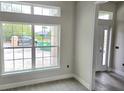 Bright room with large windows, light gray walls, and new tile flooring at 507 San Ambrosio St, Punta Gorda, FL 33983