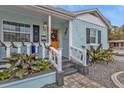 Welcoming front entry featuring steps, landscaping, and a stylish door at 509 W Olympia Ave, Punta Gorda, FL 33950