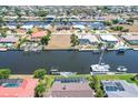 High-angle view of canal-front lot with neighboring homes and boats visible at 114 Graham Sw St, Port Charlotte, FL 33952