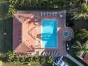 Community pool with surrounding lounge chairs and spa at 240 W End Dr # 311, Punta Gorda, FL 33950