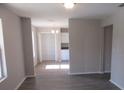 View of the living room with hardwood floors leading to the pantry and kitchen at 2410 Lanier Rd, Punta Gorda, FL 33982